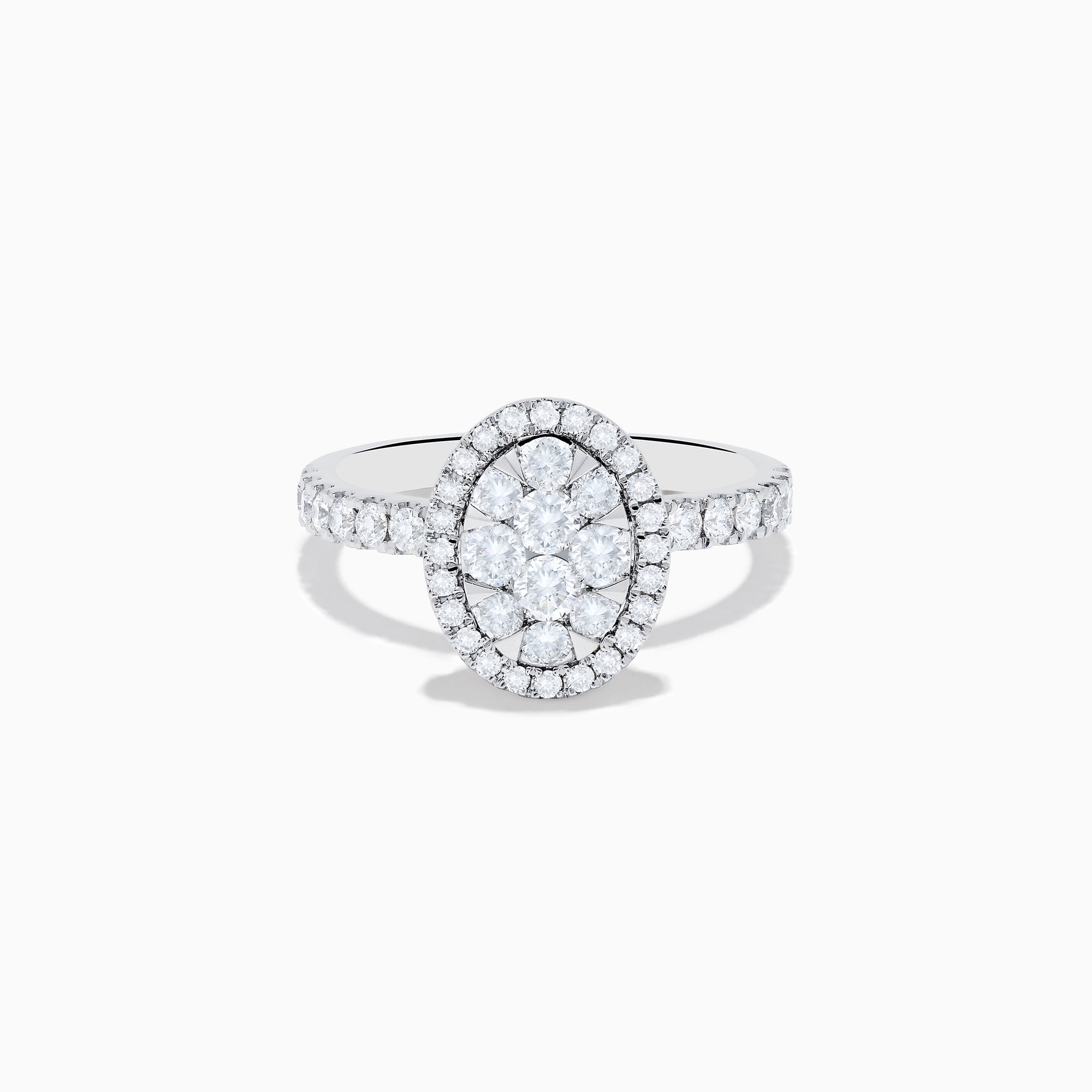 The Bouquet 14K White Gold Diamond Cluster Ring showcases an oval diamond cluster with a double halo of sparkling diamonds and extra diamonds set along the band.