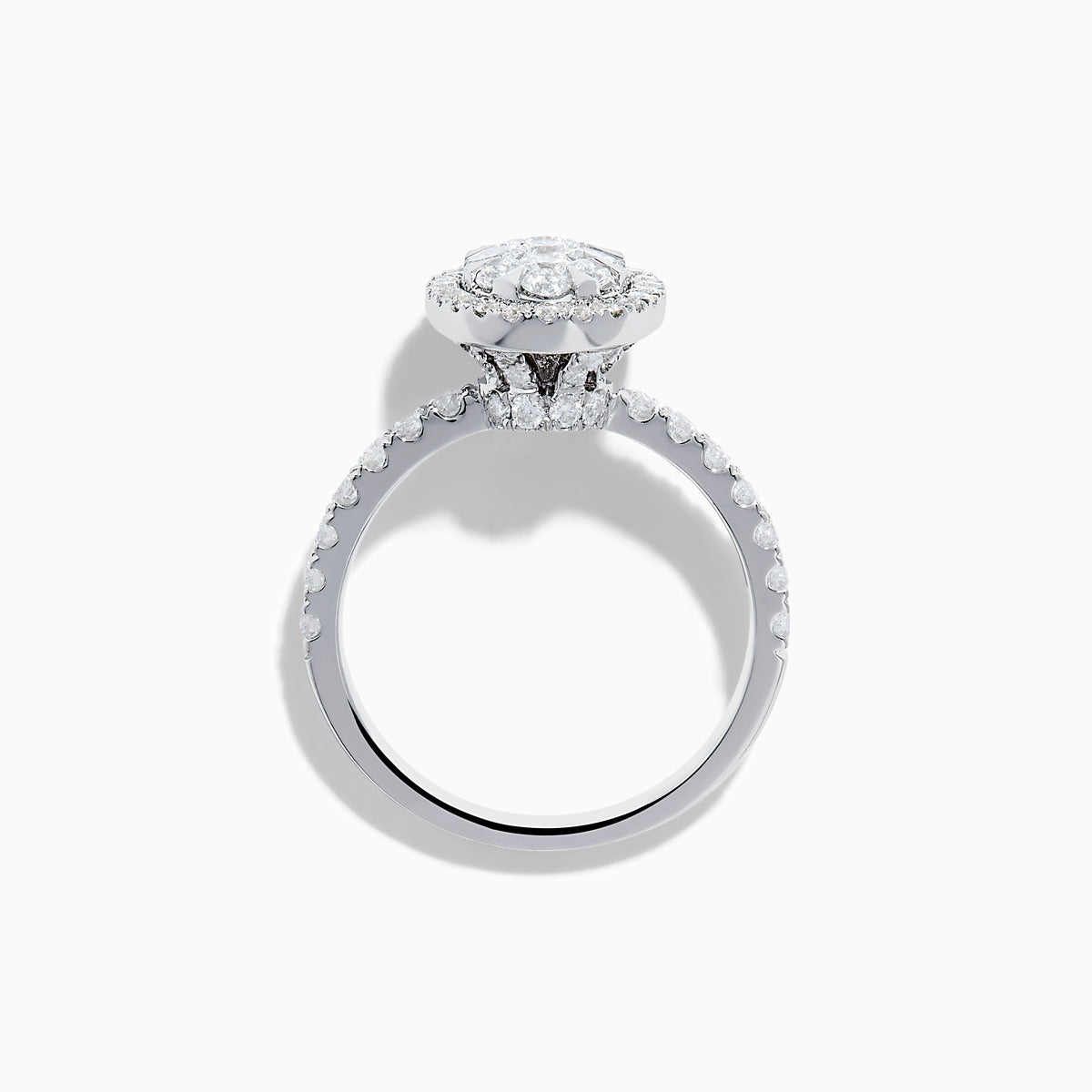 The Bouquet 14K White Gold Diamond Cluster Ring showcases an oval diamond cluster with a double halo of sparkling diamonds and extra diamonds set along the band.