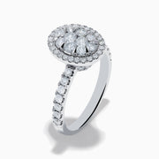 The Bouquet 14K White Gold Diamond Cluster Ring showcases an oval diamond cluster with a double halo of sparkling diamonds and extra diamonds set along the band.