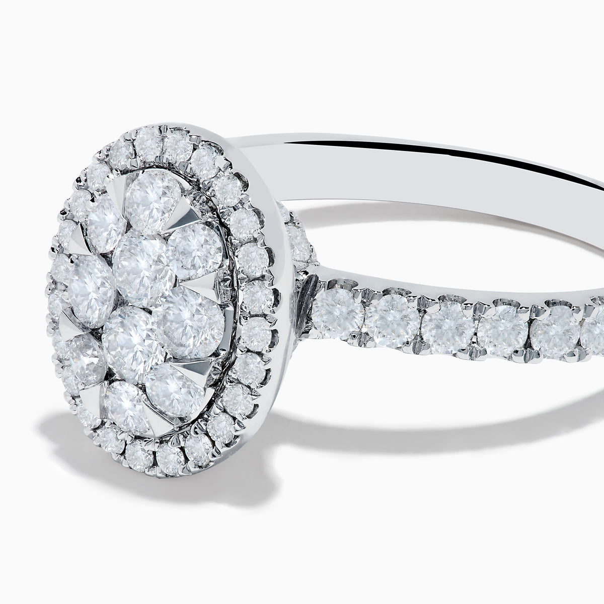 The Bouquet 14K White Gold Diamond Cluster Ring showcases an oval diamond cluster with a double halo of sparkling diamonds and extra diamonds set along the band.