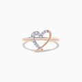 The 14K Rose Gold Diamond Open Heart Ring, featuring a delicate open heart partially adorned with sparkling diamonds, is displayed against a white background.