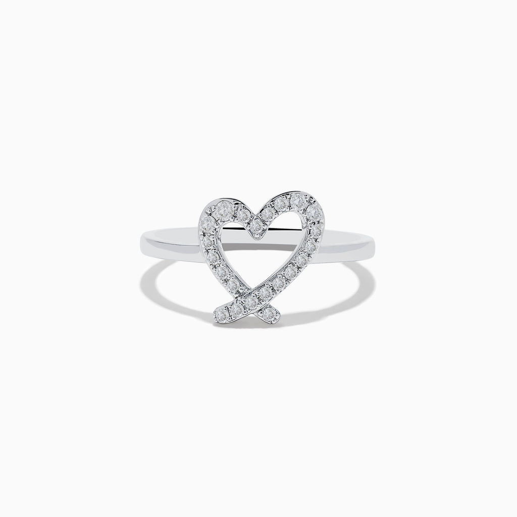 The Novelty 14K White Gold Heart Ring features an open-heart design adorned with sparkling diamonds, shown against a plain white background.