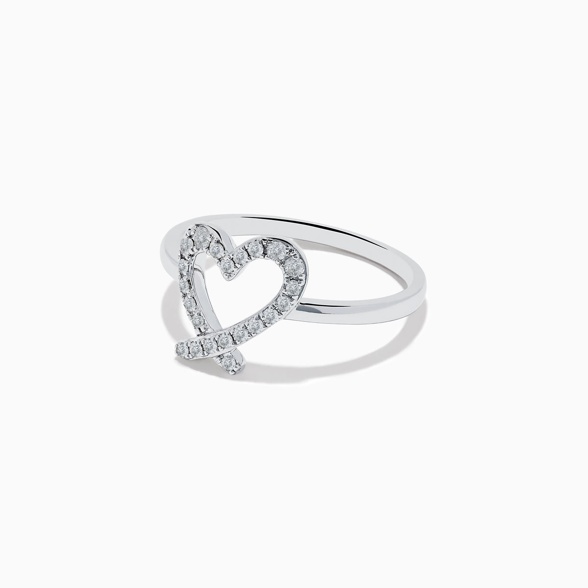 The Novelty 14K White Gold Heart Ring features an open-heart design adorned with sparkling diamonds, shown against a plain white background.