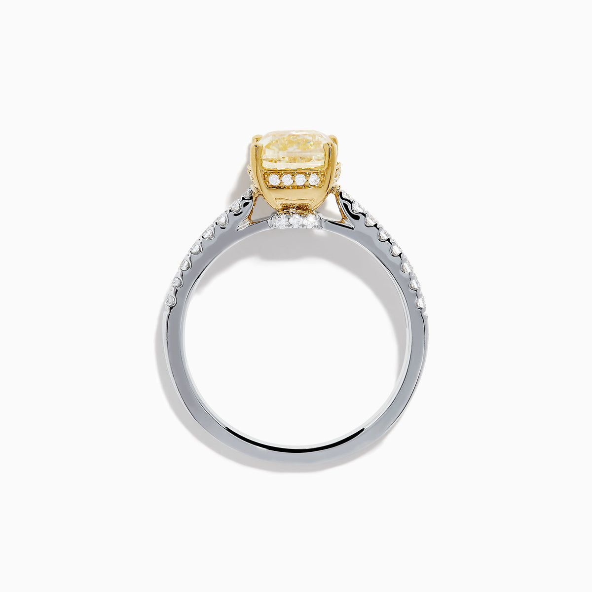 The Canare 18K Two Tone White and Yellow Diamond Ring features a cushion-cut yellow diamond centerpiece accented by small round white diamonds along the band.