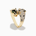 The Signature 14K Yellow Gold Diamond and Emerald Double Panther Ring showcases two panther heads—one with smooth gold and emerald-green gem eyes, the other adorned with sparkling diamonds and black gemstones—set on a white background.