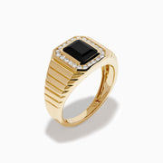 The Men's 14K Yellow Gold Onyx and Diamond Signet Ring showcases a rectangular black onyx centerpiece bordered by clear diamonds, with a ribbed band for added elegance.