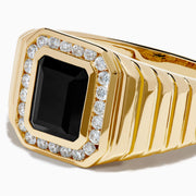 The Men's 14K Yellow Gold Onyx and Diamond Signet Ring showcases a rectangular black onyx centerpiece bordered by clear diamonds, with a ribbed band for added elegance.