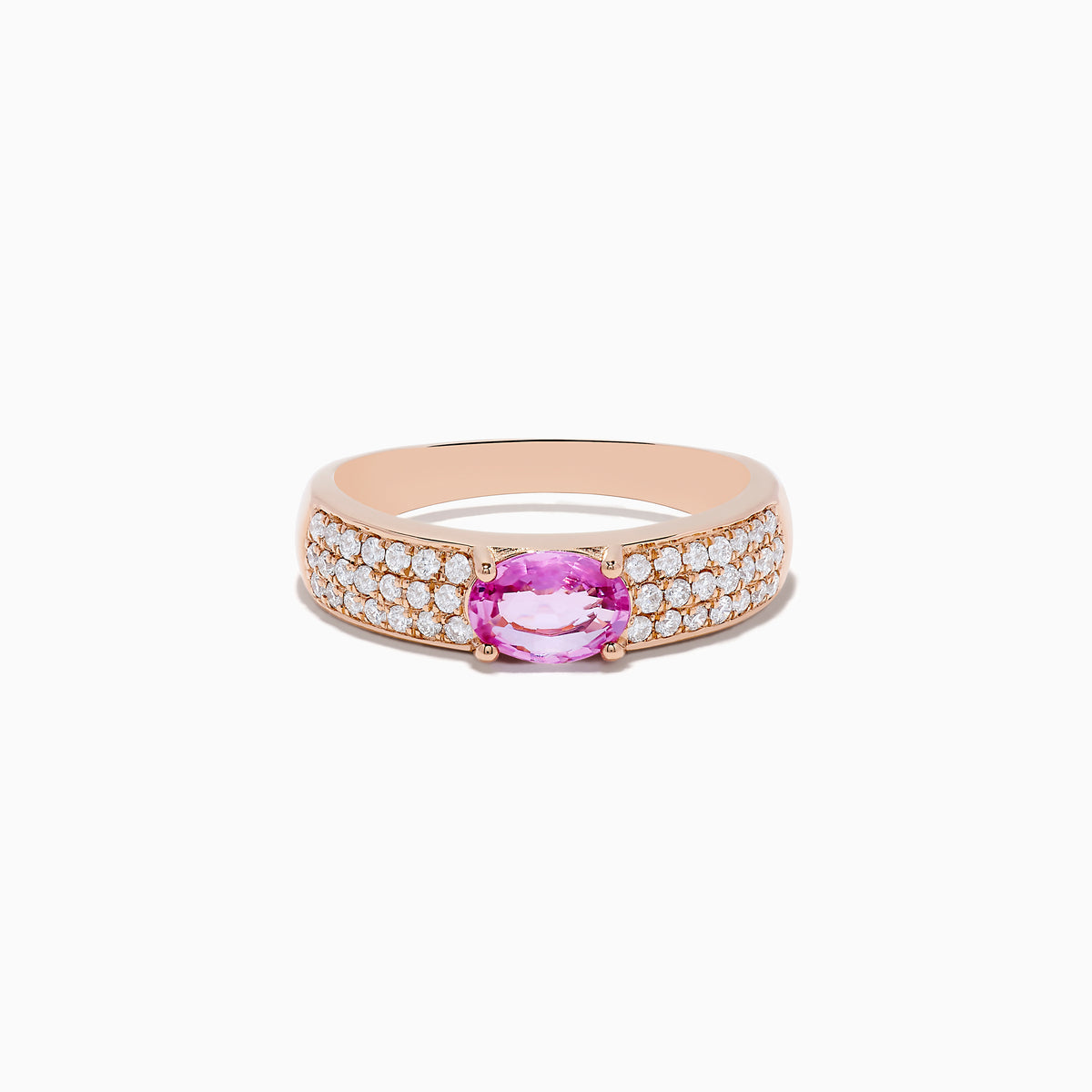 The 14K Rose Gold Pink Sapphire and Diamond Ring showcases a central oval pink sapphire, accented by rows of sparkling round diamonds along the band.