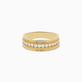 The Mens 14K Yellow Gold Diamond Ring features a central row of small round diamonds set in a channel, accented by delicate engraved details on each side.