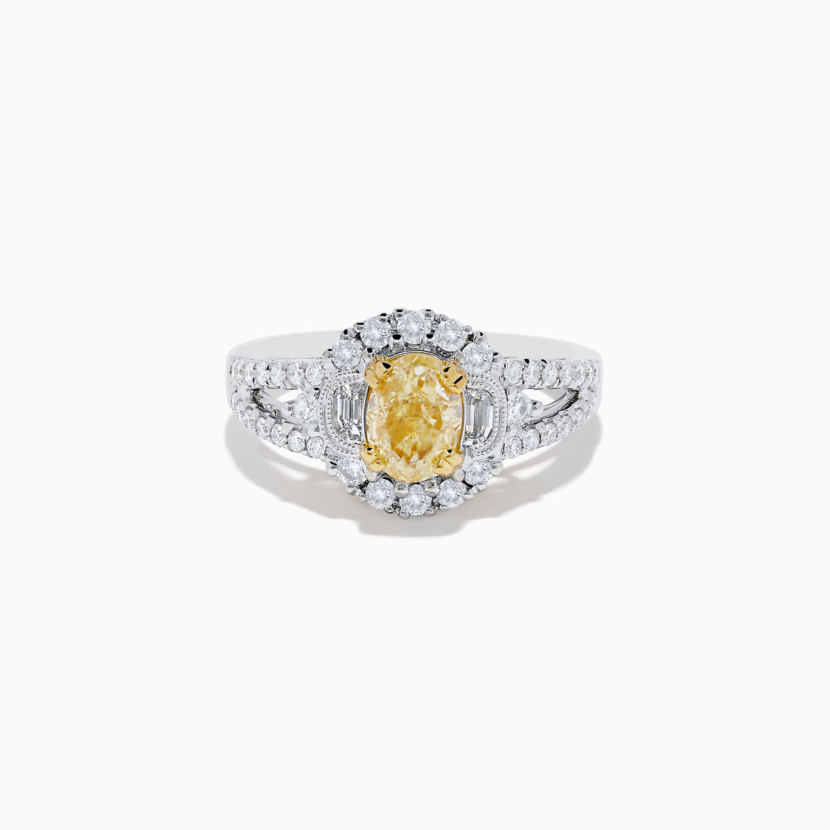 The 18K Two-Tone Gold Yellow Diamond Oval Halo Ring 1.63 TCW features a dazzling oval yellow diamond center with a halo and split shank band adorned with sparkling diamonds—a timeless, elegant design.