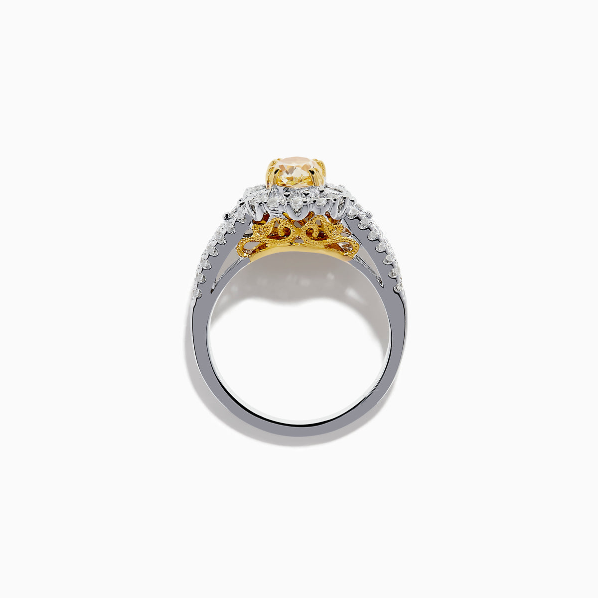 The 18K Two-Tone Gold Yellow Diamond Oval Halo Ring 1.63 TCW features a dazzling oval yellow diamond center with a halo and split shank band adorned with sparkling diamonds—a timeless, elegant design.