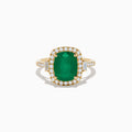 The Brasilica 14K Yellow Gold Emerald and Diamond Ring features a striking rectangular emerald at the center, surrounded by round and baguette-cut diamonds, with diamond accents along the band.