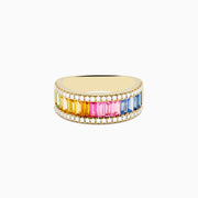 The Watercolors 14K Yellow Gold Multi Color Sapphire and Diamond Ring features a row of rectangular sapphires in rainbow order, bordered by sparkling diamonds along the top and bottom, shown against a white background.