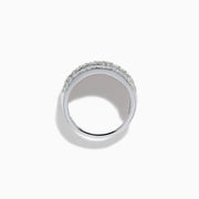 The 14K White Gold Diamond Wide Band Statement Ring showcases multiple rows of closely set round white diamonds, creating a dazzling and luxurious look against its wide, polished band. The background is plain white.