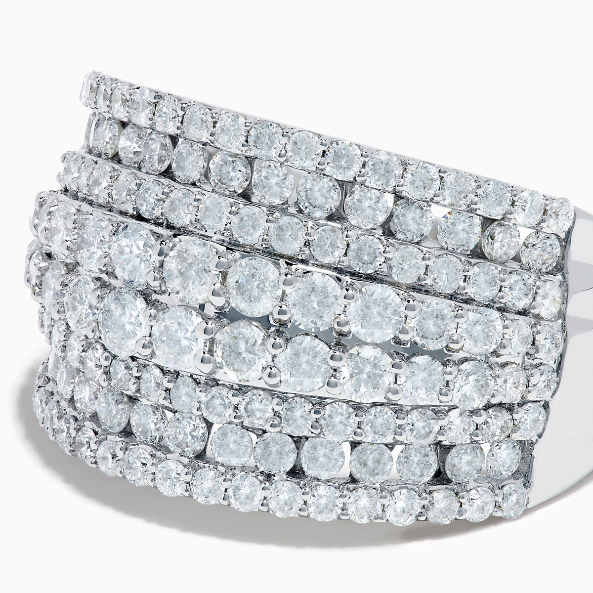 The 14K White Gold Diamond Wide Band Statement Ring showcases multiple rows of closely set round white diamonds, creating a dazzling and luxurious look against its wide, polished band. The background is plain white.