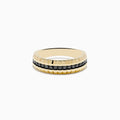 The Mens 14K Yellow Gold Black Diamond Ring features a textured, ridged yellow gold band with a central row of small black diamonds, shown against a plain white background.