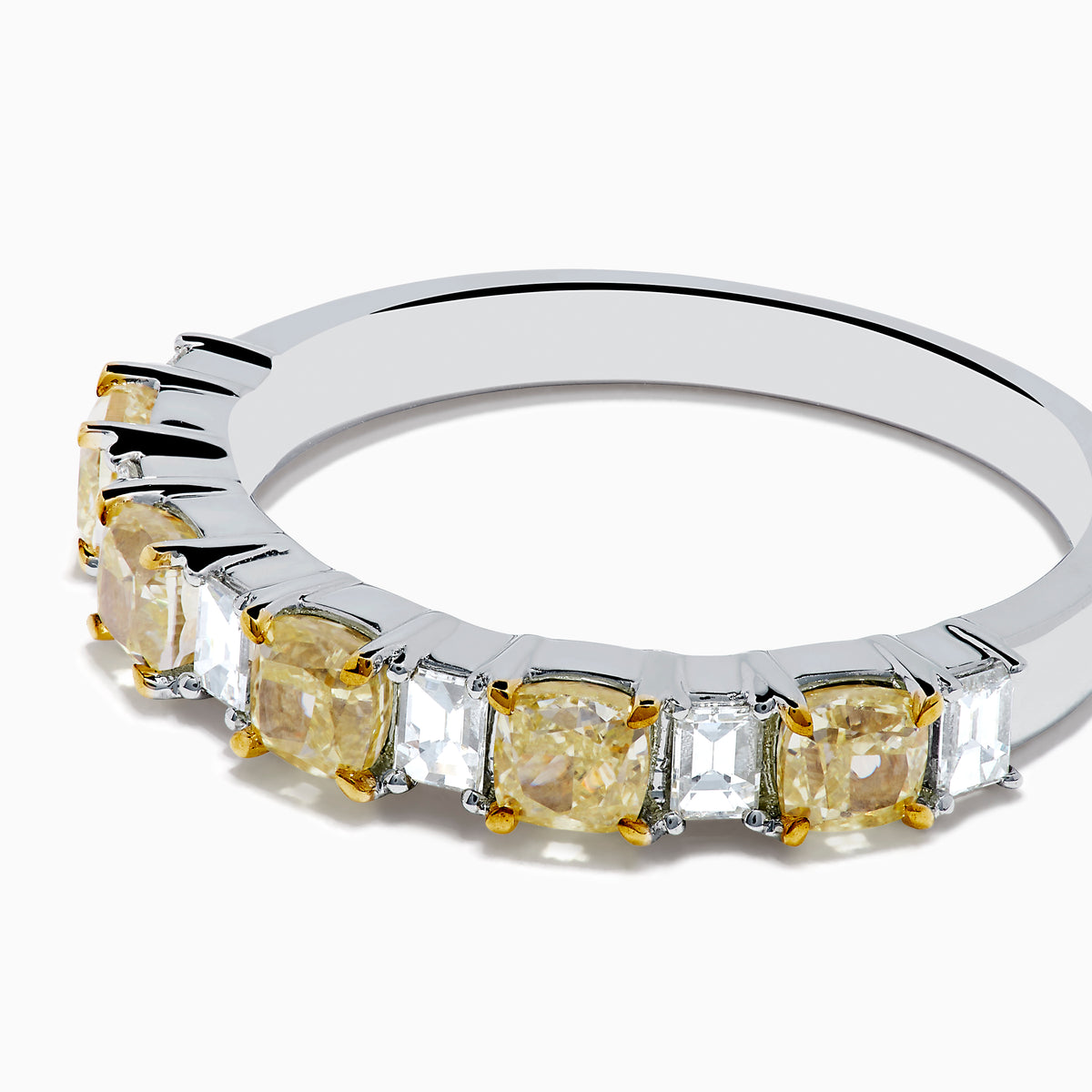 The Canare 18K Two Tone Gold White and Yellow Gold Diamond Band Ring features alternating rectangular yellow and clear diamonds set in a row along the band, shown on a white background.