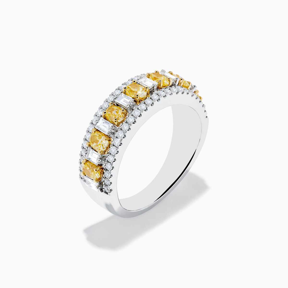 An 18K Two Tone Gold White and Yellow Diamond Wide Band Ring featuring a row of rectangular yellow diamonds bordered by two rows of small round white diamonds, shown on a white background.