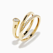 The 14K Yellow Gold Diamond Wrap Ring features two intertwined bands—one with a pear-shaped clear gemstone, the other accented by sparkling round diamonds along the top half—for an elegant, dazzling look.