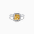 The Canare 18K Two Tone Gold White and Yellow Diamond Ring features a large rectangular yellow gemstone, double halo of white diamonds, and diamond accents on the elegant band.