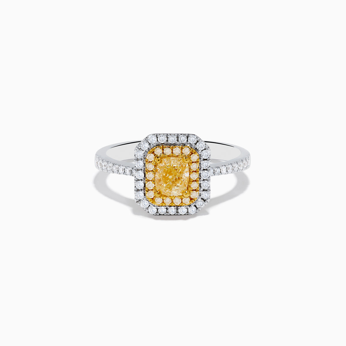 The Canare 18K Two Tone Gold White and Yellow Diamond Ring features a large rectangular yellow gemstone, double halo of white diamonds, and diamond accents on the elegant band.