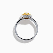 The Canare 18K Two Tone Gold White and Yellow Diamond Ring features a large rectangular yellow gemstone, double halo of white diamonds, and diamond accents on the elegant band.