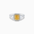 The Canare 18K Two Tone Gold White & Yellow Diamond Ring showcases a rectangular yellow gemstone, double halo of white and yellow diamonds, and diamond-accented band—a striking statement piece.