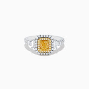 The Canare 18K Two Tone Gold White & Yellow Diamond Ring showcases a rectangular yellow gemstone, double halo of white and yellow diamonds, and diamond-accented band—a striking statement piece.