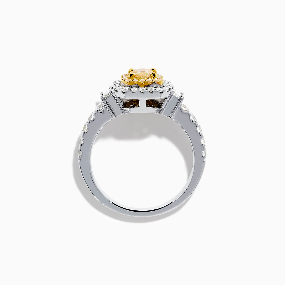 The Canare 18K Two Tone Gold White & Yellow Diamond Ring showcases a rectangular yellow gemstone, double halo of white and yellow diamonds, and diamond-accented band—a striking statement piece.