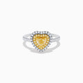 The Canare 18K Two Tone Gold White & Yellow Diamond Heart Ring features a heart-shaped yellow gemstone center with a double halo of yellow and clear diamonds, inspired by elegant Canare designs.