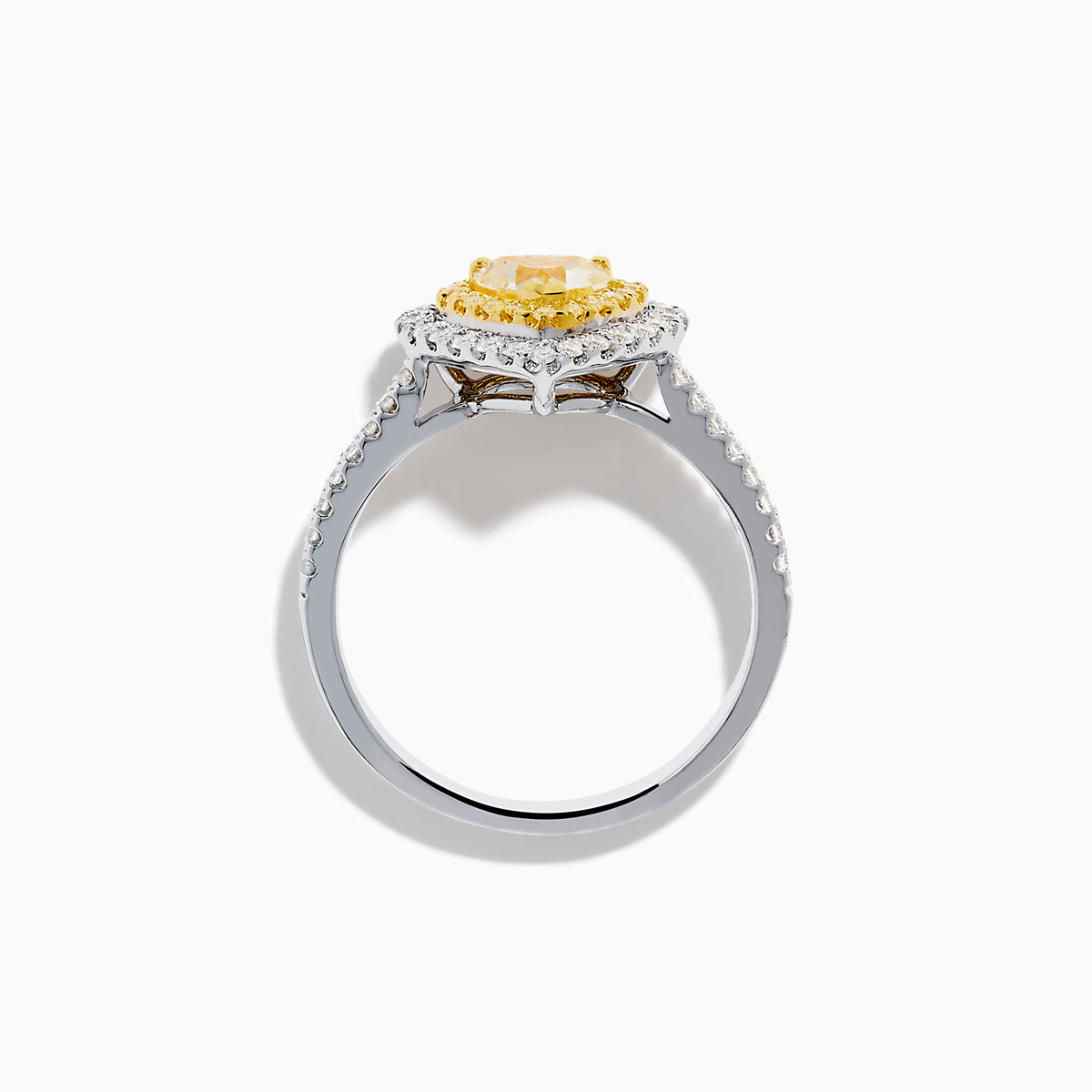 The Canare 18K Two Tone Gold White & Yellow Diamond Heart Ring features a heart-shaped yellow gemstone center with a double halo of yellow and clear diamonds, inspired by elegant Canare designs.