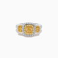 The Canare 18K Two Tone Gold White and Yellow Diamond Ring features a large rectangular yellow diamond center, encircled by rows of yellow and white diamonds, with side yellow diamonds bordered by sparkling white stones.