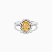 A close-up of the Canare 18K Two Tone Gold White & Yellow Diamond Ring, highlighting its oval yellow center stone encircled by two halos of white diamonds and additional diamonds set along the elegant silver band.