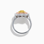 The Trio 18K Tri Color Gold White, Pink, and Yellow Diamond Heart Ring features a yellow diamond center, surrounded by pink and white diamonds on an 18K gold band for a luxurious finish.