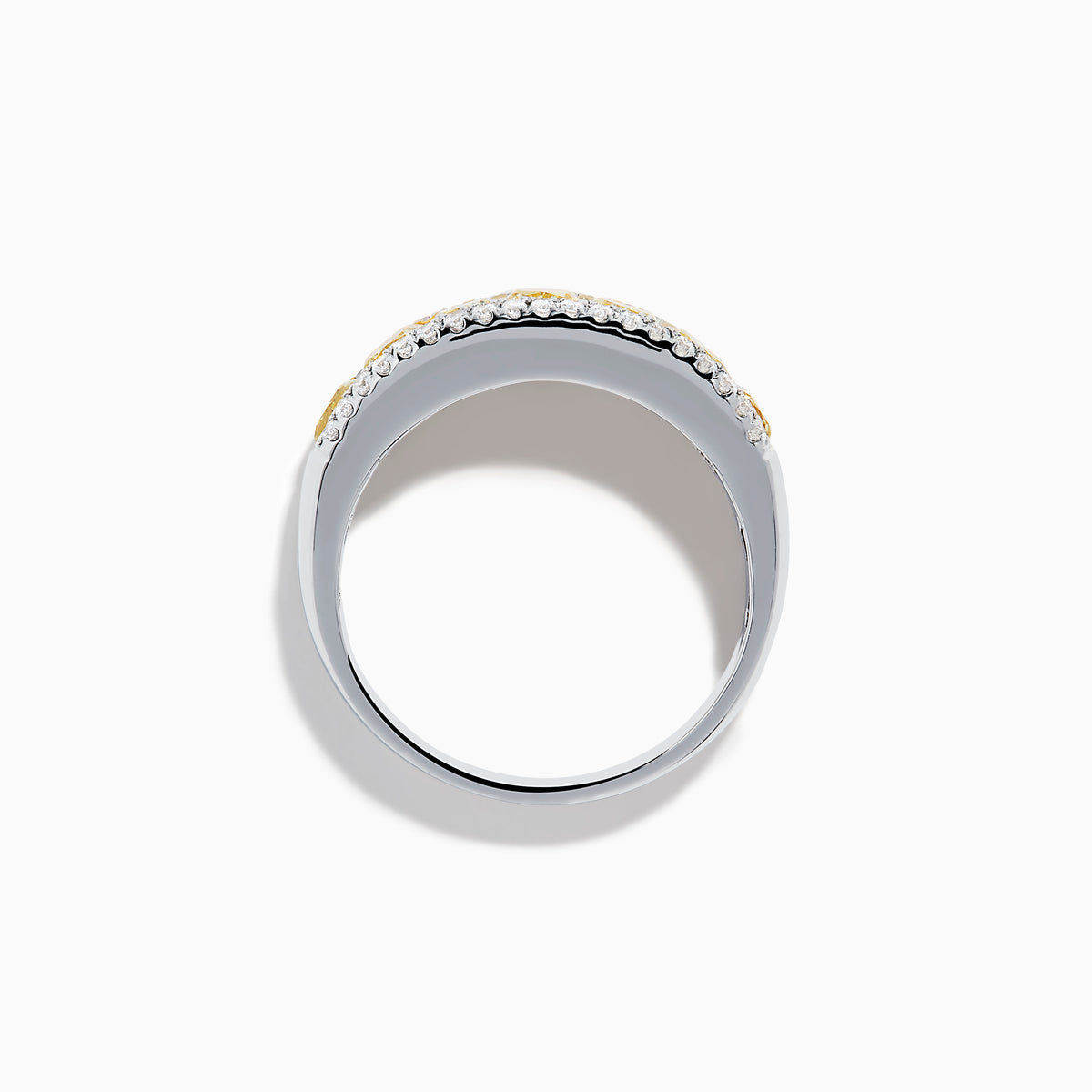 The Canare 18K Two Tone Gold White and Yellow Diamond Band Ring features a central row of yellow diamonds bordered by two rows of white diamonds, beautifully displayed on a white background.