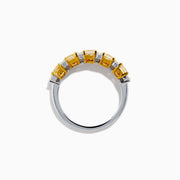 The Canare 18K Two Tone Gold White and Yellow Diamond Band Ring features rectangular yellow and round white diamonds set in prongs along a sleek two-tone gold band.