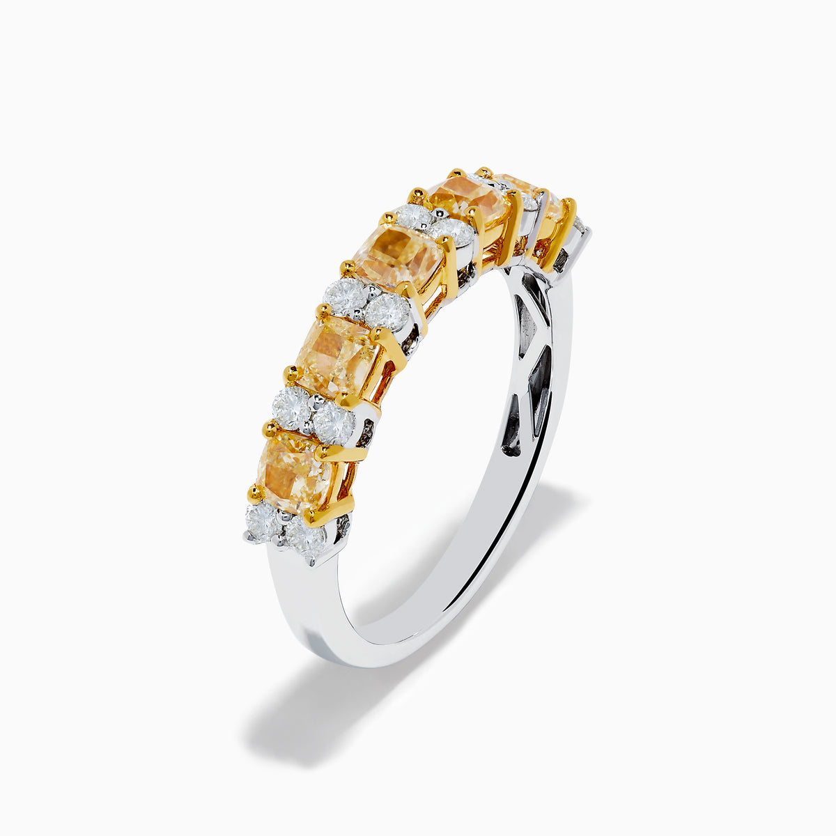 The Canare 18K Two Tone Gold White and Yellow Diamond Band Ring features rectangular yellow and round white diamonds set in prongs along a sleek two-tone gold band.