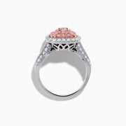 The 18K Two Tone Gold White and Pink Diamond Ring features a cushion-shaped cluster of pink diamonds at the center, encircled by a double halo of white diamonds, with more diamonds set along the band.