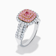 The 18K Two Tone Gold White and Pink Diamond Ring features a cushion-shaped cluster of pink diamonds at the center, encircled by a double halo of white diamonds, with more diamonds set along the band.