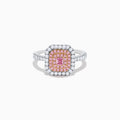 The 18K Two Tone Gold White and Pink Diamond Ring showcases a square pink diamond center, double rows of pink diamonds, an outer border of round white diamonds, and additional diamonds set along the band.