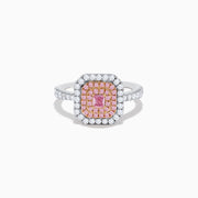 The 18K Two Tone Gold White and Pink Diamond Ring showcases a square pink diamond center, double rows of pink diamonds, an outer border of round white diamonds, and additional diamonds set along the band.