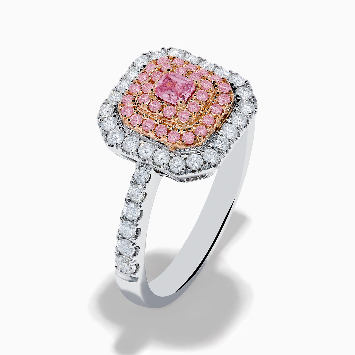 The 18K Two Tone Gold White and Pink Diamond Ring showcases a square pink diamond center, double rows of pink diamonds, an outer border of round white diamonds, and additional diamonds set along the band.