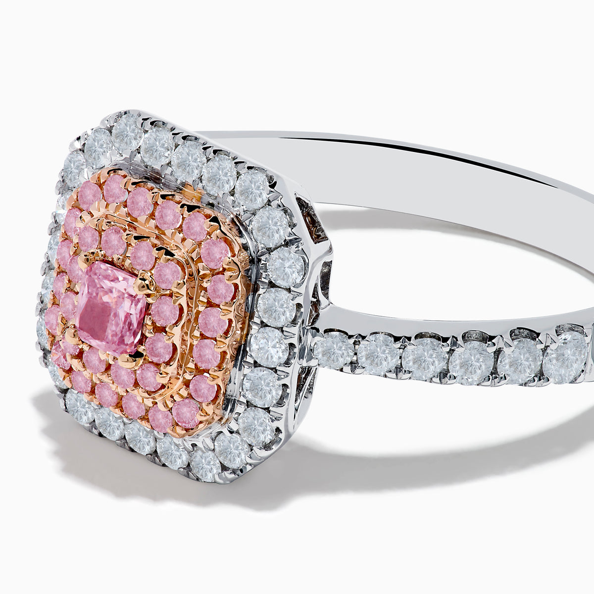The 18K Two Tone Gold White and Pink Diamond Ring showcases a square pink diamond center, double rows of pink diamonds, an outer border of round white diamonds, and additional diamonds set along the band.