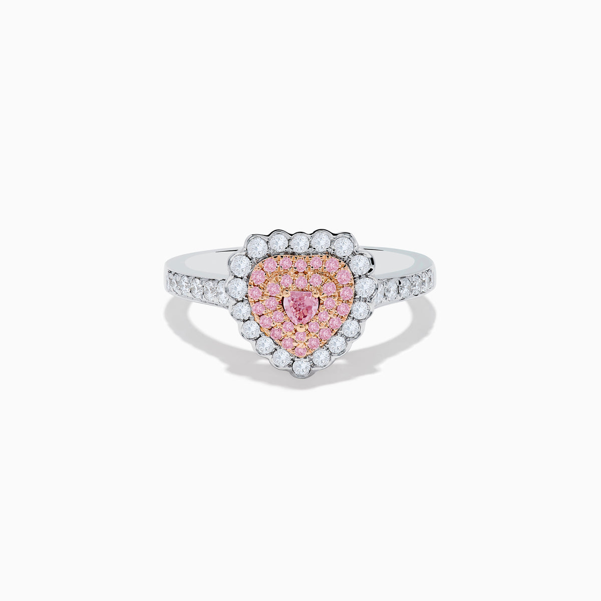 The 18K Two Tone Gold White and Pink Diamond Heart Ring features a heart design with pink diamonds at the center, white diamonds encircling the heart, and additional diamonds along the band for extra sparkle.