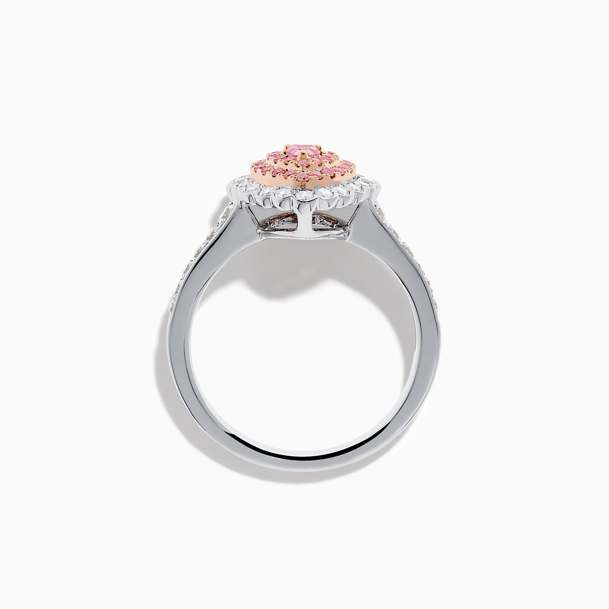 The 18K Two Tone Gold White and Pink Diamond Heart Ring features a heart design with pink diamonds at the center, white diamonds encircling the heart, and additional diamonds along the band for extra sparkle.