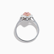 The 18K Two Tone Gold White and Pink Diamond Ring features a teardrop-shaped center with a pink gemstone, surrounded by pink and white stones, set on a band adorned with sparkling white diamonds.
