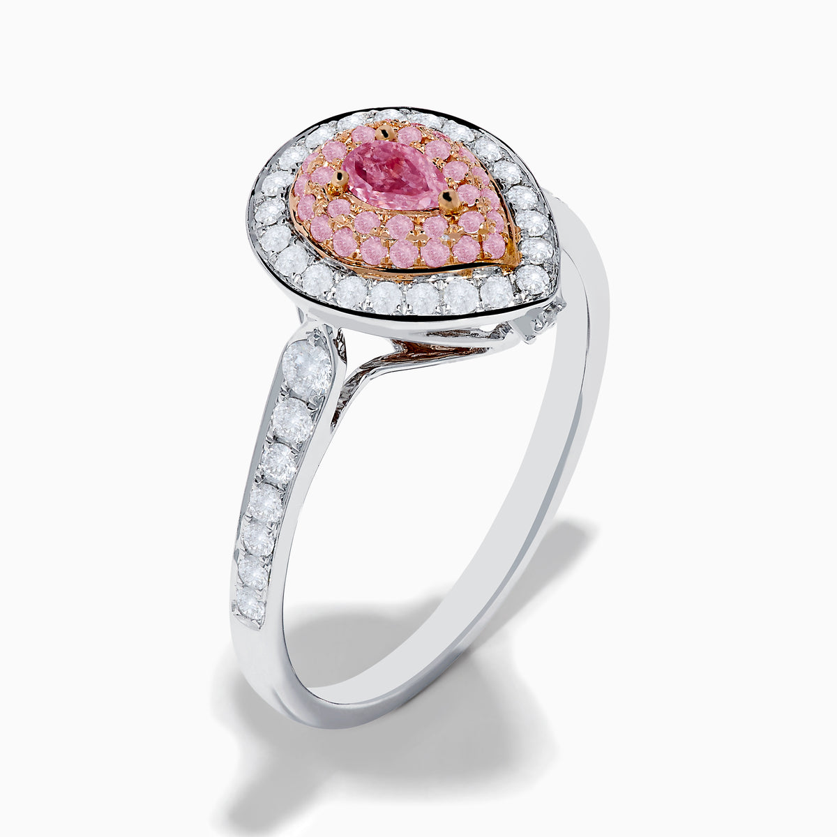 The 18K Two Tone Gold White and Pink Diamond Ring features a teardrop-shaped center with a pink gemstone, surrounded by pink and white stones, set on a band adorned with sparkling white diamonds.