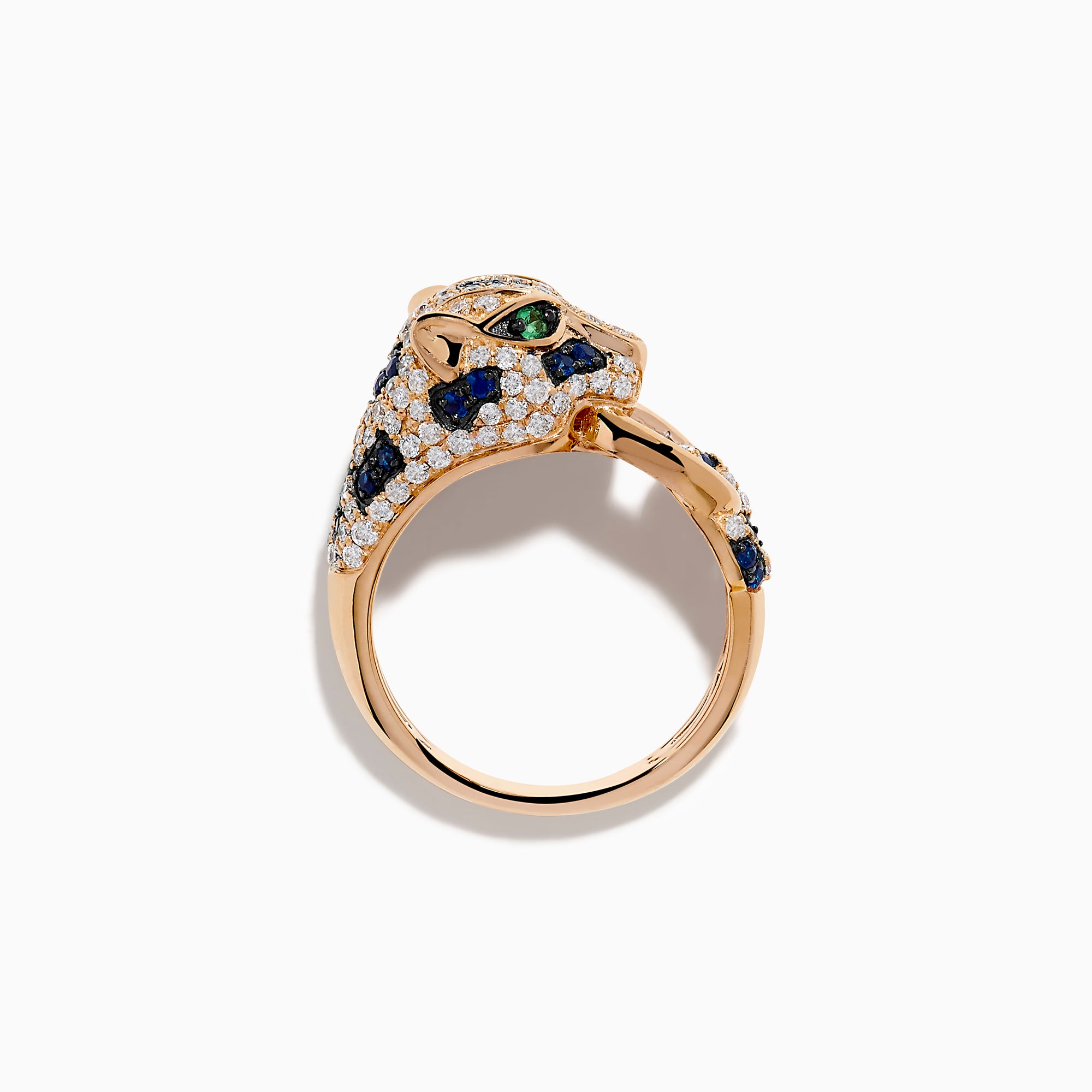 The Signature 14K Rose Gold Diamond, Sapphire and Emerald Ring features a panther’s head encrusted with white diamonds, blue sapphires, and green emeralds, with the panther biting a ring in its mouth.