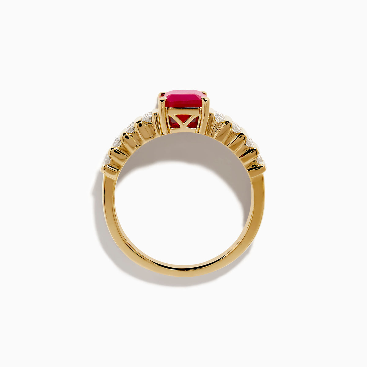 The Ruby Royale 14K Yellow Gold Ruby and Diamond Ring features a rectangular red ruby center, accented by three rows of small round diamonds on each side, all showcased against a white background.