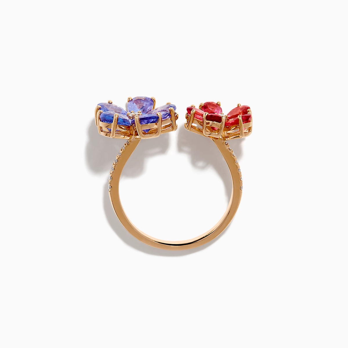 The 14K Rose Gold Tanzanite, Tourmaline and Diamond Floral Ring features two flower designs with tanzanite blue and pink tourmaline petals, each centered by a sparkling diamond, all set against a white background.